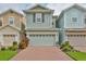 Modern townhome with two-car garage and brick driveway at 6378 Camino Dr, Apollo Beach, FL 33572