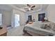 Main bedroom with private bathroom access and ceiling fan at 6378 Camino Dr, Apollo Beach, FL 33572