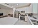 Bright kitchen featuring stainless steel appliances and white cabinetry at 6378 Camino Dr, Apollo Beach, FL 33572