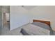 Bright bedroom with double bed and access to hallway at 6378 Camino Dr, Apollo Beach, FL 33572