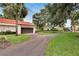 Exterior of home showing driveway, landscaping, and neighboring homes at 103 Capri N Ct, Plant City, FL 33566