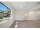 Bedroom with a view of backyard through window at 6750 W Flamingo S Way, St Petersburg, FL 33707