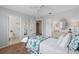 Bright bedroom with a floral comforter and en-suite bathroom at 10713 Cape Hatteras Dr, Tampa, FL 33615