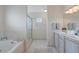 Large bathroom with double vanity and walk-in shower at 10713 Cape Hatteras Dr, Tampa, FL 33615