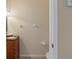 Simple half bathroom with dark vanity and toilet at 10713 Cape Hatteras Dr, Tampa, FL 33615
