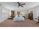 Bright bedroom with large window and wooden furniture at 10713 Cape Hatteras Dr, Tampa, FL 33615
