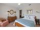 Charming bedroom with a dresser and light blue bedding at 10713 Cape Hatteras Dr, Tampa, FL 33615