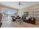 Spacious Gathering room with leather seating, a glass-top coffee table, and pool views at 10713 Cape Hatteras Dr, Tampa, FL 33615