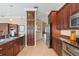 Modern kitchen with ample cabinetry, granite countertops, and stainless steel appliances at 10713 Cape Hatteras Dr, Tampa, FL 33615