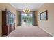 Bright dining room with pool view, chandelier, and built-in hutch at 10713 Cape Hatteras Dr, Tampa, FL 33615