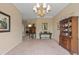 Spacious dining room featuring hardwood floors and elegant furnishings at 10713 Cape Hatteras Dr, Tampa, FL 33615