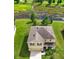 Two-story house with a brown roof, situated on a grassy lot near a wetland at 35716 Hillbrook Ave, Zephyrhills, FL 33541