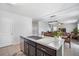 Kitchen island with granite countertop and stainless steel sink at 35716 Hillbrook Ave, Zephyrhills, FL 33541