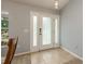 Bright entryway with tiled floor and white door at 9911 Golden Loop, New Port Richey, FL 34654