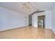 Bright dining room with light wood flooring and view into kitchen at 10922 Brucehaven Dr, Riverview, FL 33578