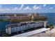 Aerial view of waterfront condo building with parking at 5960 30Th S Ave # 502, Gulfport, FL 33707