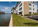 Building exterior showcases waterfront location and landscaping at 5960 30Th S Ave # 502, Gulfport, FL 33707