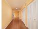 Long hallway with tile floors and neutral walls at 5960 30Th S Ave # 502, Gulfport, FL 33707