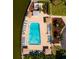 Aerial view of a condo complex pool with surrounding lounge chairs at 5960 30Th S Ave # 502, Gulfport, FL 33707