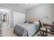 Spacious bedroom with a queen bed, and access to hallway at 5014 Ruby Flats Dr, Wimauma, FL 33598