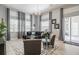 Bright living room with hardwood floors, large windows and comfortable seating at 5014 Ruby Flats Dr, Wimauma, FL 33598