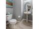 Small powder room with pedestal sink and toilet at 5014 Ruby Flats Dr, Wimauma, FL 33598