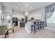 Modern kitchen with ample cabinetry, breakfast bar, and a view into the living area at 5014 Ruby Flats Dr, Wimauma, FL 33598