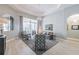 Cozy living room with hardwood floors, large windows and comfortable seating at 5014 Ruby Flats Dr, Wimauma, FL 33598