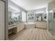 Luxurious Primary bathroom featuring a corner soaking tub and double sinks at 5014 Ruby Flats Dr, Wimauma, FL 33598