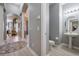 Powder room with pedestal sink and toilet at 5014 Ruby Flats Dr, Wimauma, FL 33598