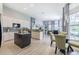 Open concept kitchen boasts a large island, granite countertops, and stainless steel appliances at 5014 Ruby Flats Dr, Wimauma, FL 33598