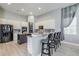 Spacious kitchen with white cabinets, granite counters, and a large island at 5014 Ruby Flats Dr, Wimauma, FL 33598