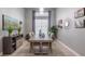 Elegant dining room with a modern table and wall art at 5014 Ruby Flats Dr, Wimauma, FL 33598