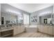 Spacious Primary bathroom with dual vanities, a large soaking tub and separate shower at 5014 Ruby Flats Dr, Wimauma, FL 33598