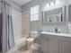 Clean bathroom, featuring a shower/tub combo and gray vanity at 5014 Ruby Flats Dr, Wimauma, FL 33598