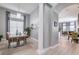 Bright dining room features a spacious table and access to the living room at 5014 Ruby Flats Dr, Wimauma, FL 33598