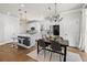 Elegant dining area with a black table, gray chairs, and chandelier at 2953 Pier Pointe Ln, Clearwater, FL 33760