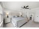 Bright bedroom featuring a king-size bed and large windows at 2953 Pier Pointe Ln, Clearwater, FL 33760