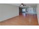 Spacious living room featuring hardwood floors, a double-door entryway, and natural light at 1185 Sorrento Woods Blvd, Nokomis, FL 34275