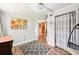 Well-lit bedroom with a view of the kitchen at 2419 Roxbury Cir, North Port, FL 34287