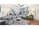 Cozy living room featuring hardwood floors and comfortable seating at 2419 Roxbury Cir, North Port, FL 34287