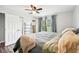 Bright bedroom featuring a comfortable bed and large windows at 2419 Roxbury Cir, North Port, FL 34287