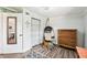 Relaxing bedroom with a hanging chair and dresser at 2419 Roxbury Cir, North Port, FL 34287