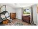 Cozy bedroom with a hanging chair and two dressers at 2419 Roxbury Cir, North Port, FL 34287