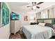 Spacious bedroom with a dresser and TV at 2419 Roxbury Cir, North Port, FL 34287