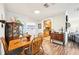 Light-filled dining area with wood table and chairs near kitchen at 2419 Roxbury Cir, North Port, FL 34287