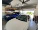 Spacious two-car garage with ample storage shelving at 132 Peckham Se St, Port Charlotte, FL 33952