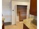 Walk-in pantry with wooden shelves for storage at 132 Peckham Se St, Port Charlotte, FL 33952