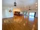 Open living room with hardwood floors and kitchen island at 132 Peckham Se St, Port Charlotte, FL 33952