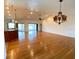 Open living room with hardwood floors and kitchen island at 132 Peckham Se St, Port Charlotte, FL 33952